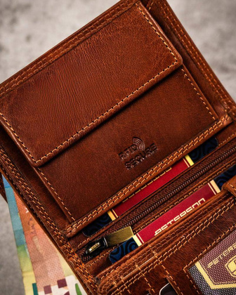 Duży, skórzany portfel męski z wytłoczonym znakiem zodiaku