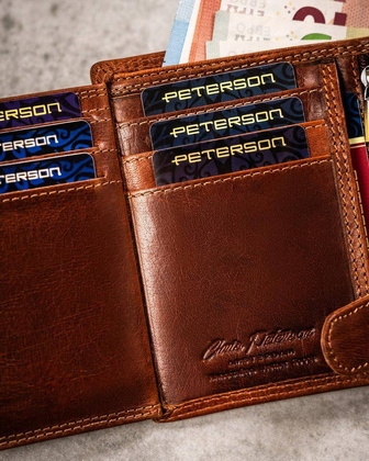 Duży, skórzany portfel męski z wytłoczonym znakiem zodiaku